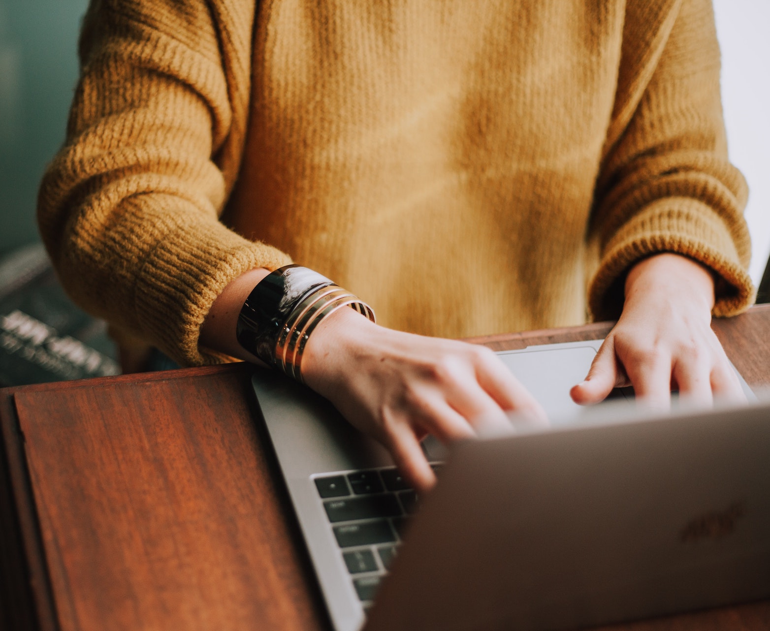 Girl on laptop preparing for virtual nutrition coaching with virtual registered dietitian