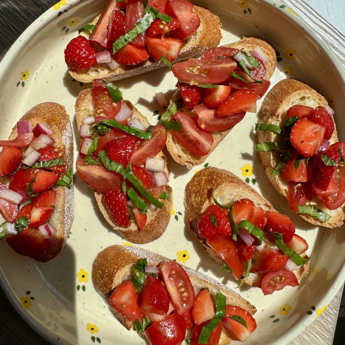 strawberry basil bruschetta on a plate.