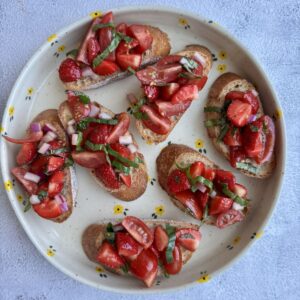 strawberry basil bruschetta on a plate.