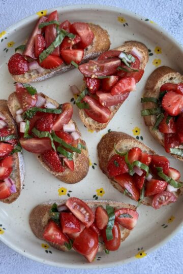 strawberry basil bruschetta on a plate.