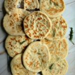 greek pitas on a tray.