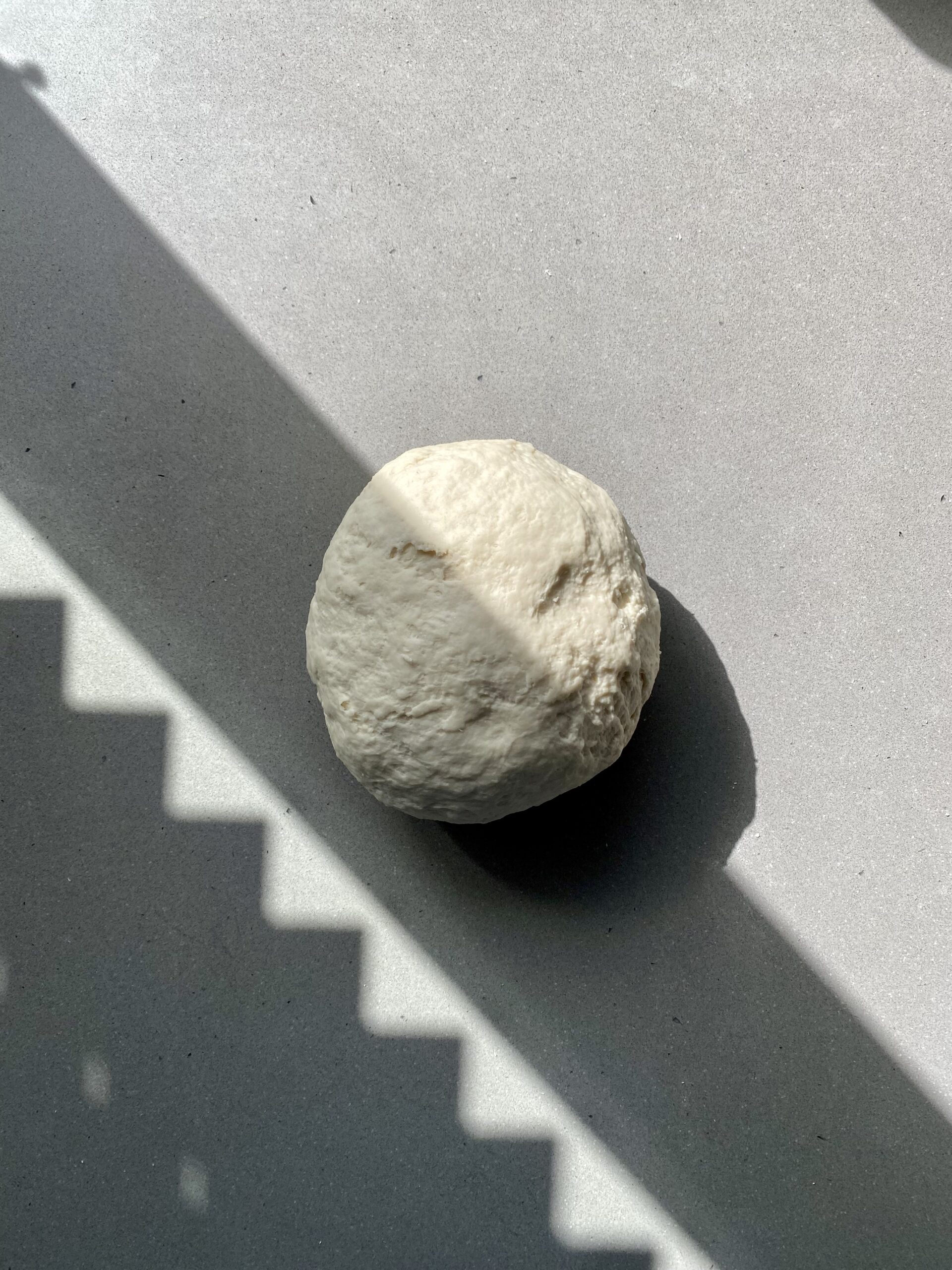 dough ball formed on the counter.