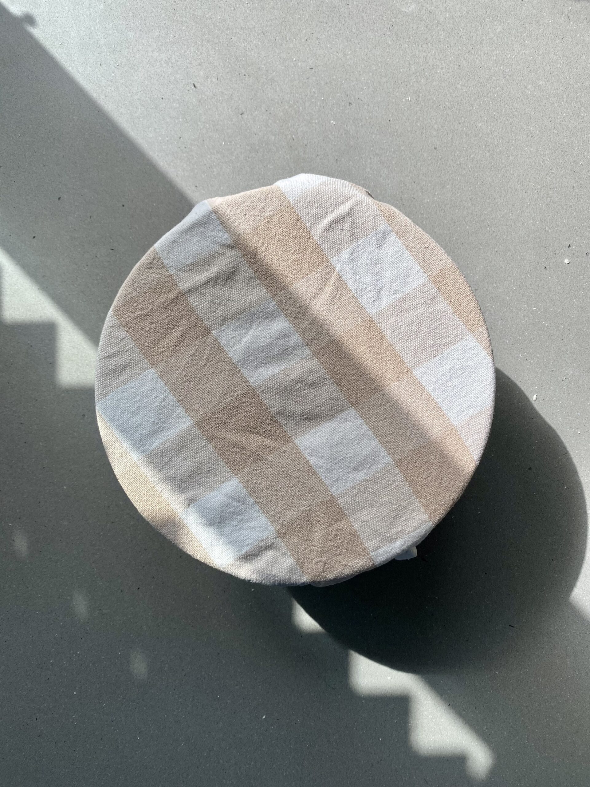 bowl on the counter with a cover on it.