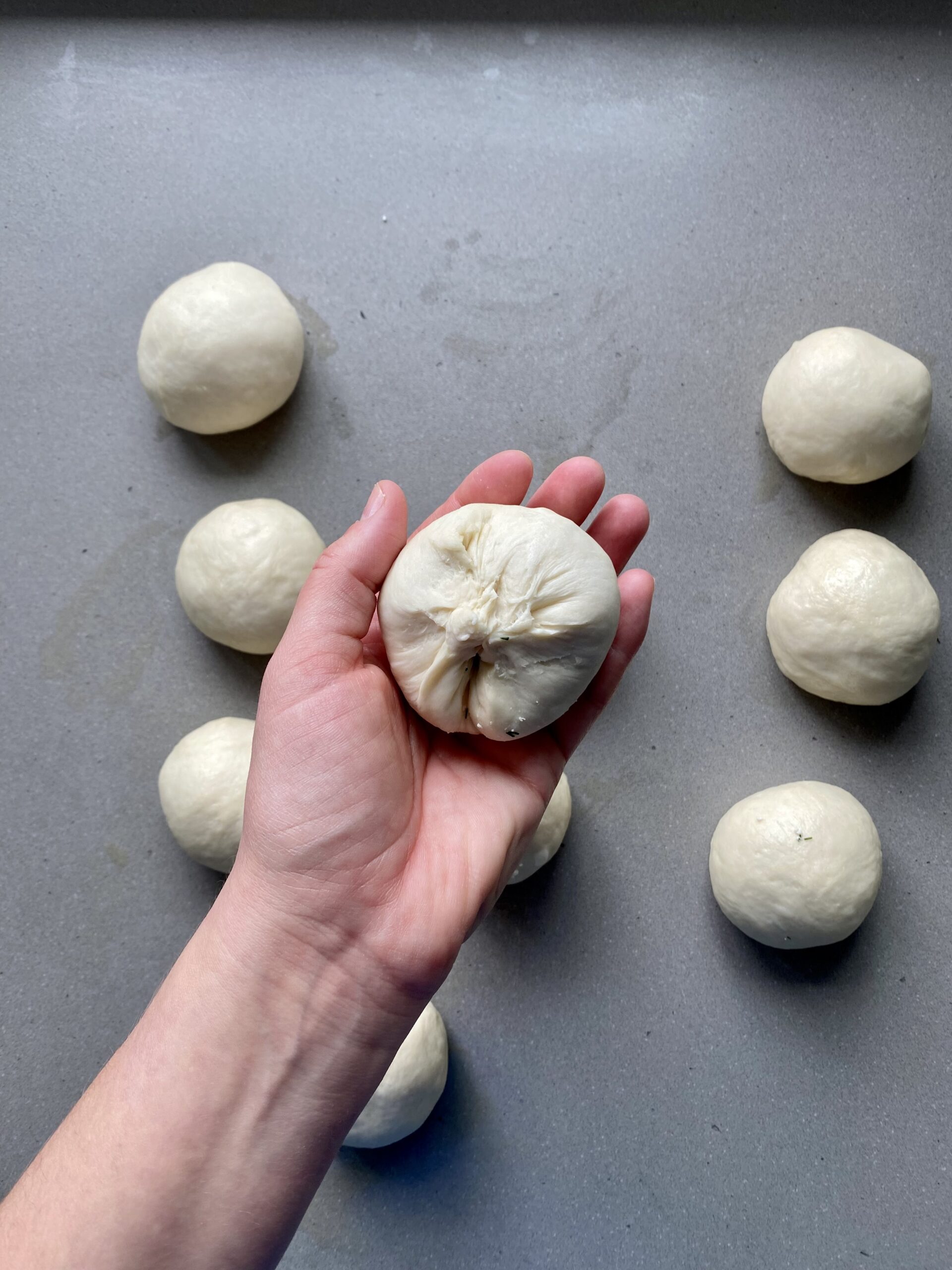 one dough ball stuffed with feta and dill.