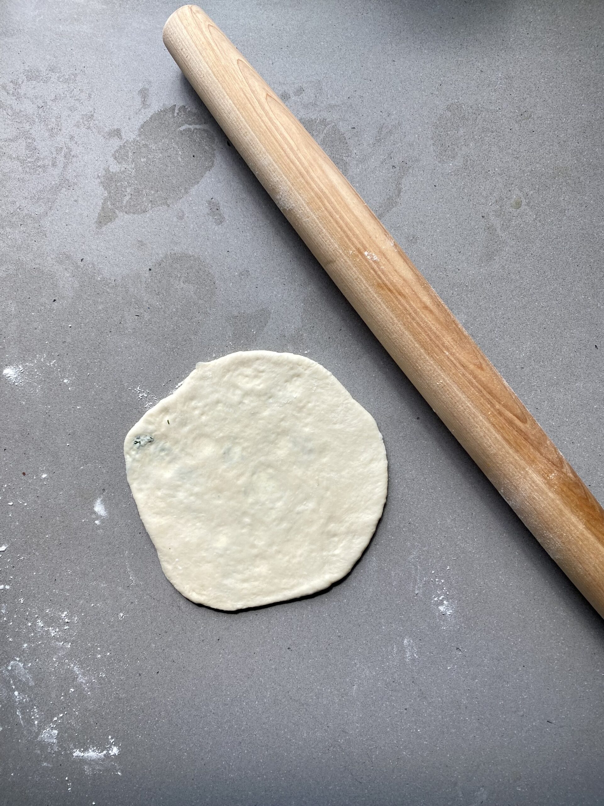 stuffed dough ball rolled into a disc.