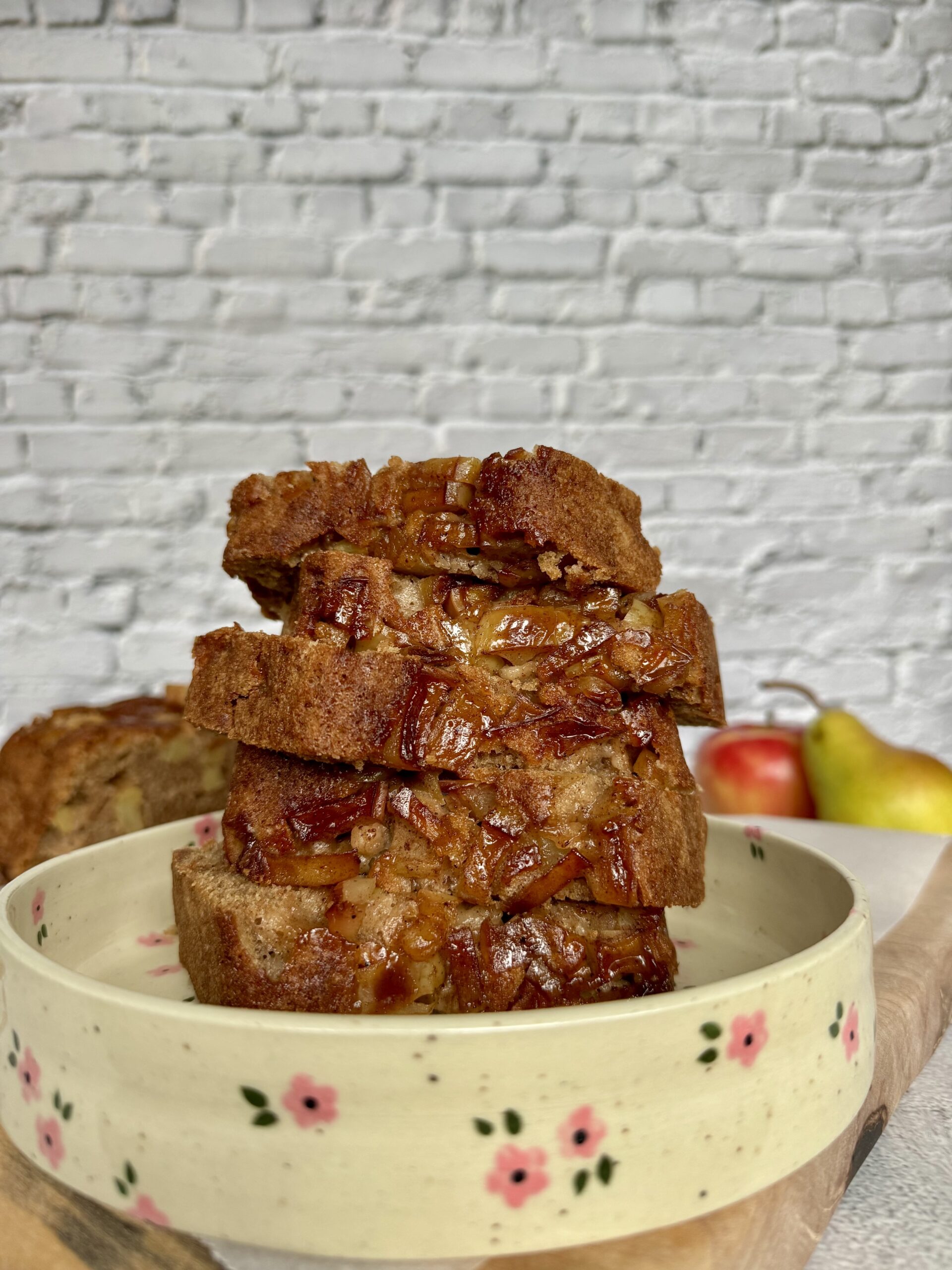 spiced apple pear load sliced on a plate.