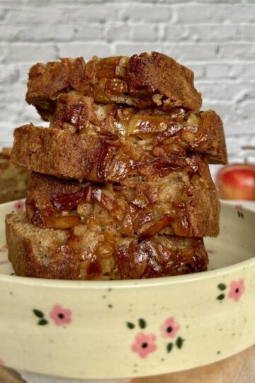 sliced apple pear loaf on a plate.