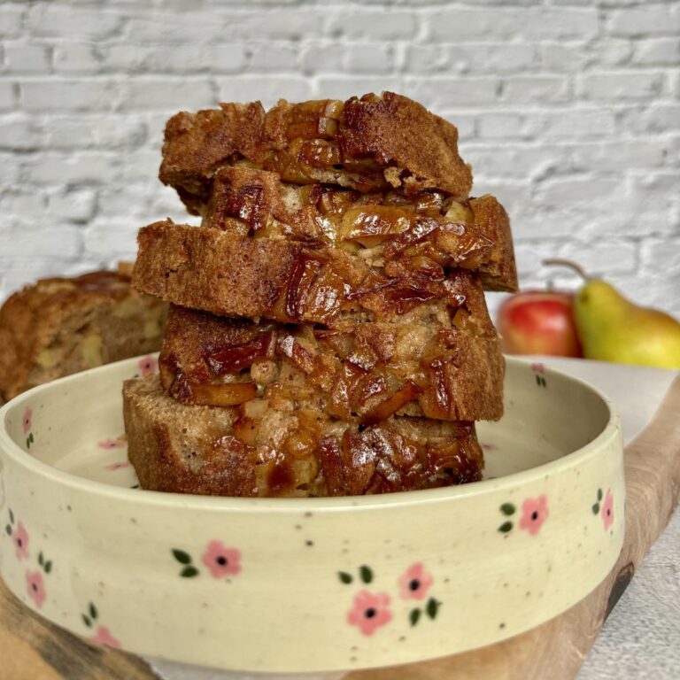 sliced apple pear loaf on a plate.