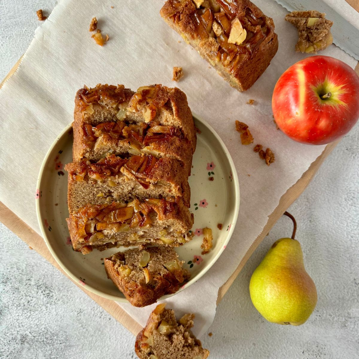 sliced apple pear loaf on a plate.