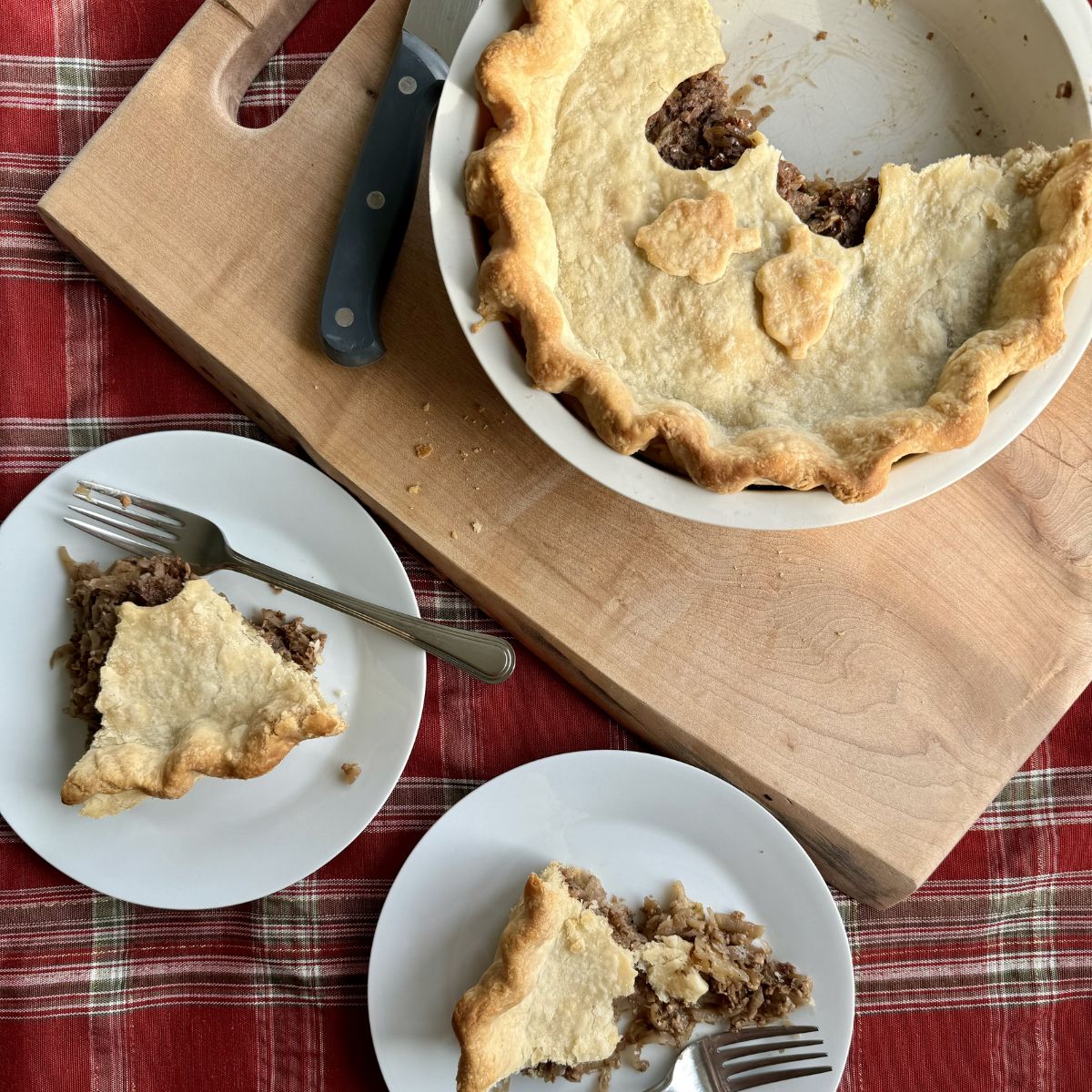 vegan meat pie served on two white plates.