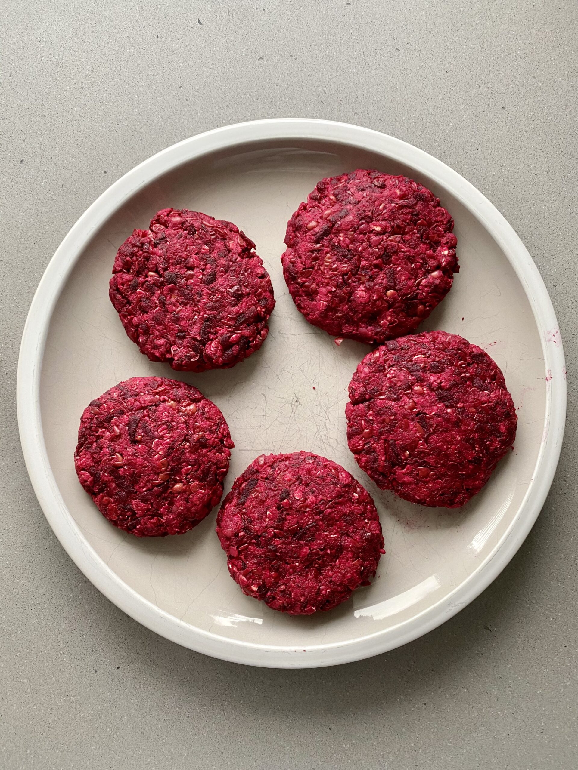 beet burger patties on a plate.