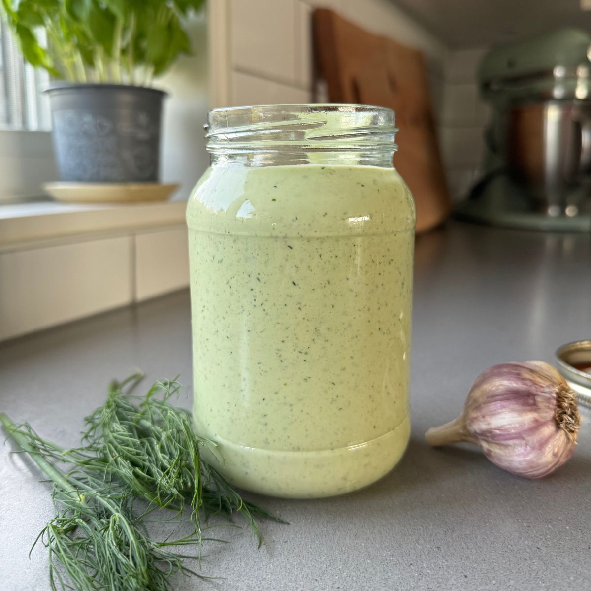 dill pickle dressing in a mason jar.