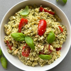 pesto orzo salad recipe in a white bowl