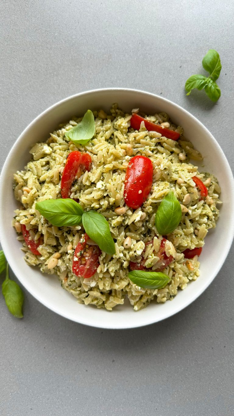 pesto orzo salad recipe in a white bowl