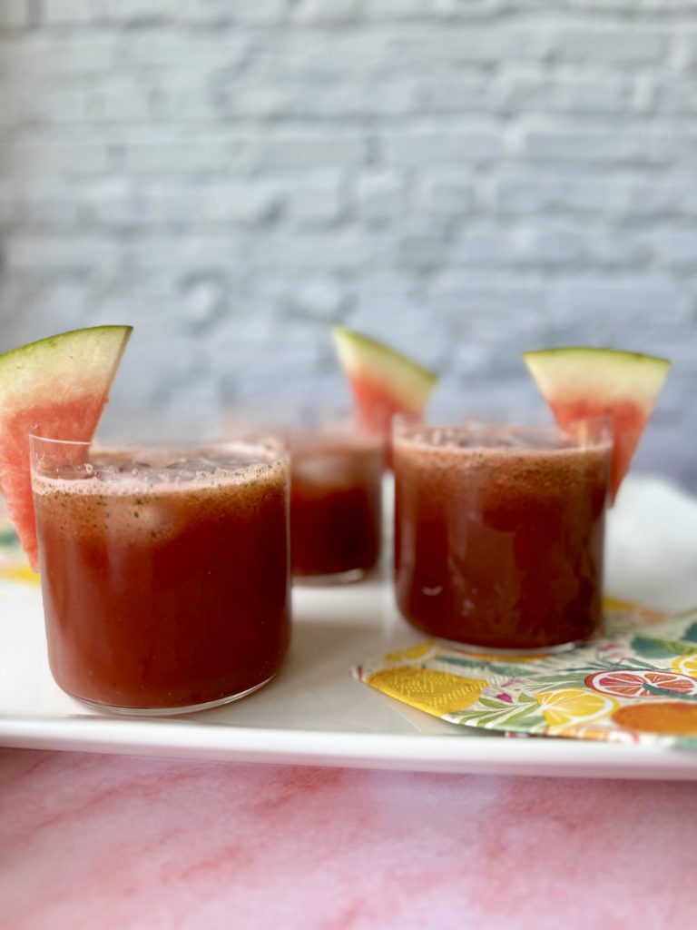watermelon mint refresher in four glasses with watermelon garnish