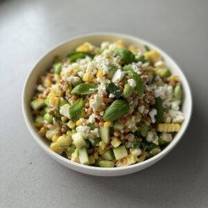 edamame lentil salad in a white bowl.