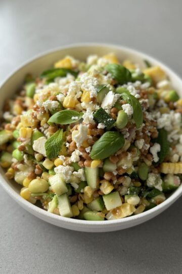 edamame lentil salad in a white bowl.