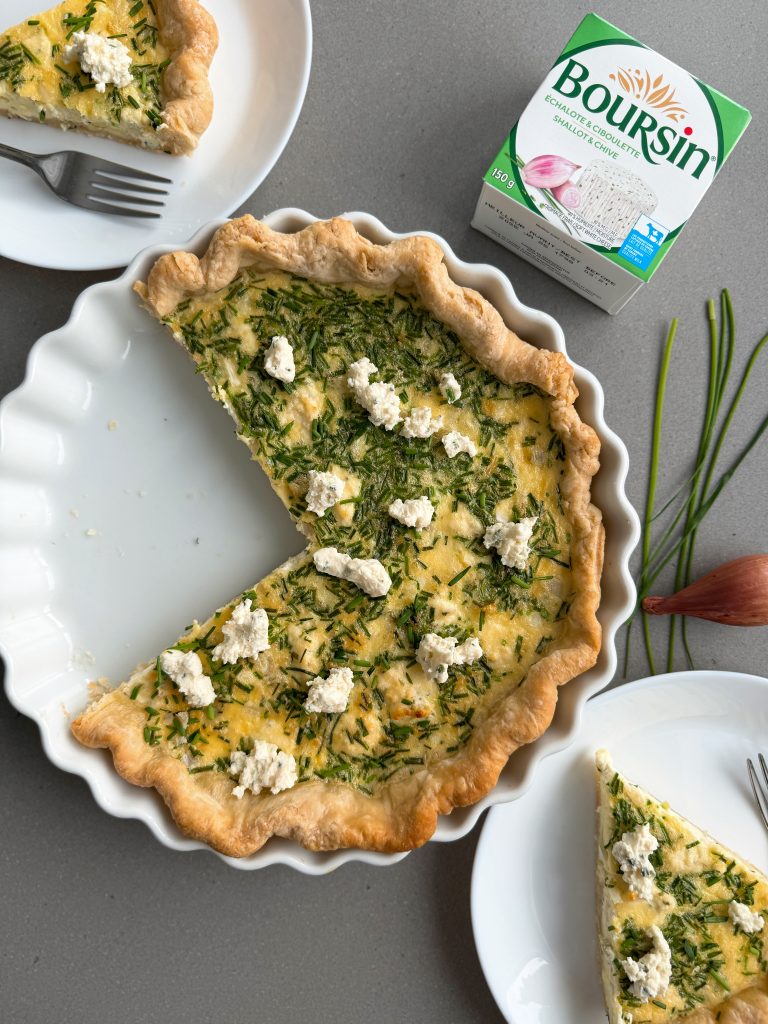 slices of boursin quiche on white plates