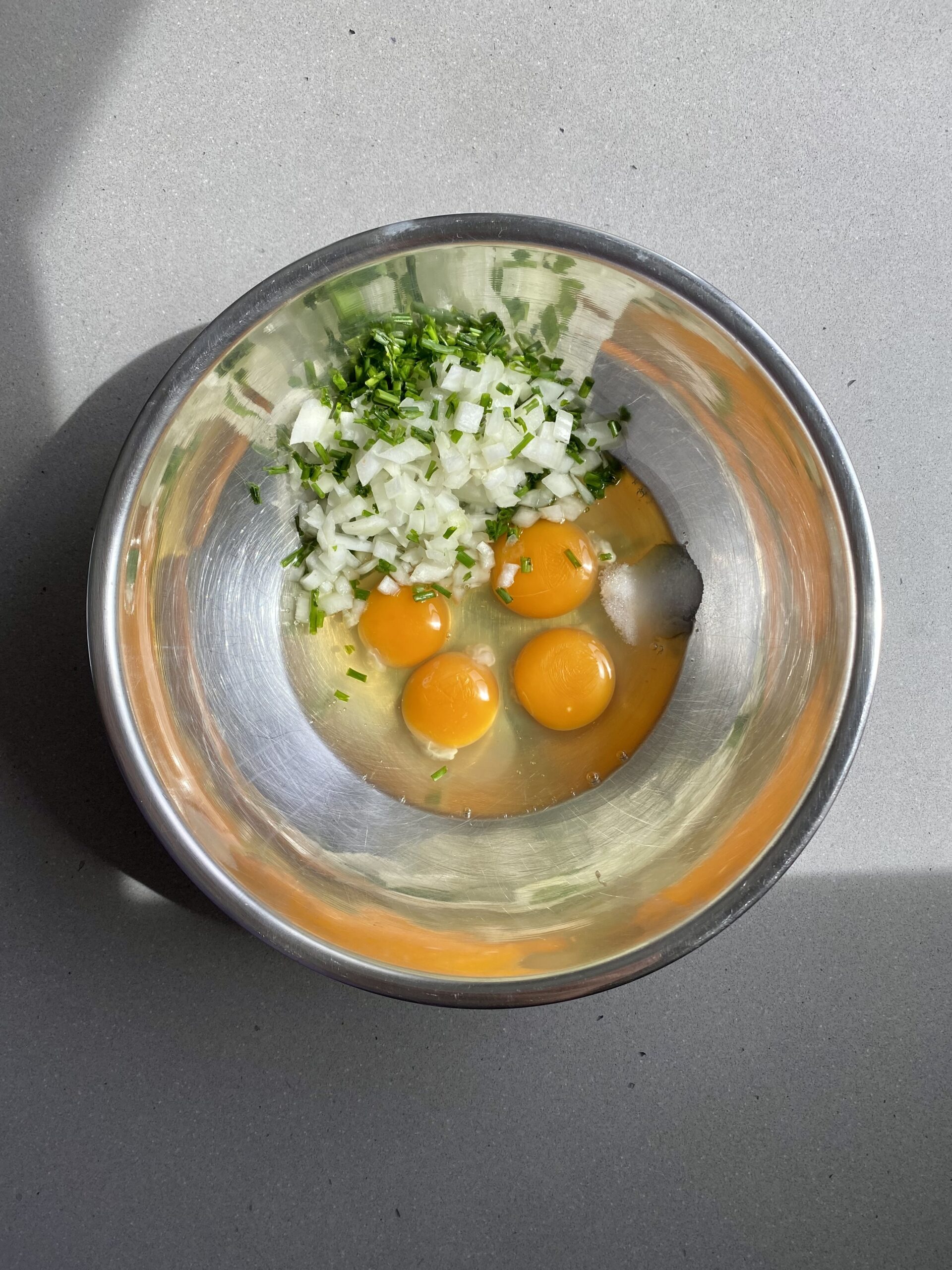wet ingredients including eggs, herbs, shallot.