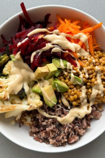 wild rice buddha bowl in a white bowl.