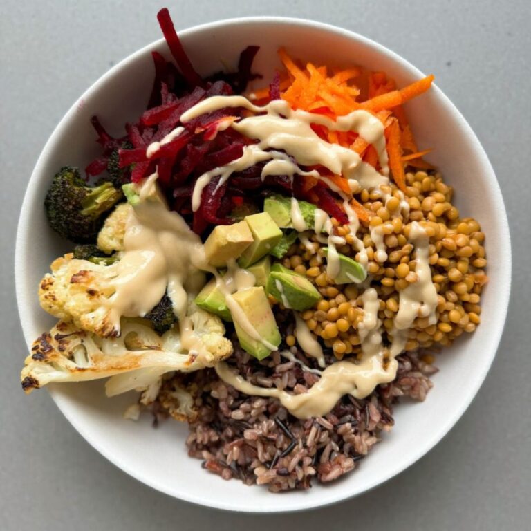 wild rice buddha bowl in a white bowl.