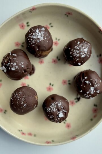 peanut butter date balls on a plate.
