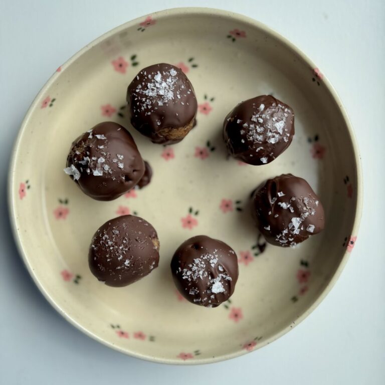 peanut butter date balls on a plate.