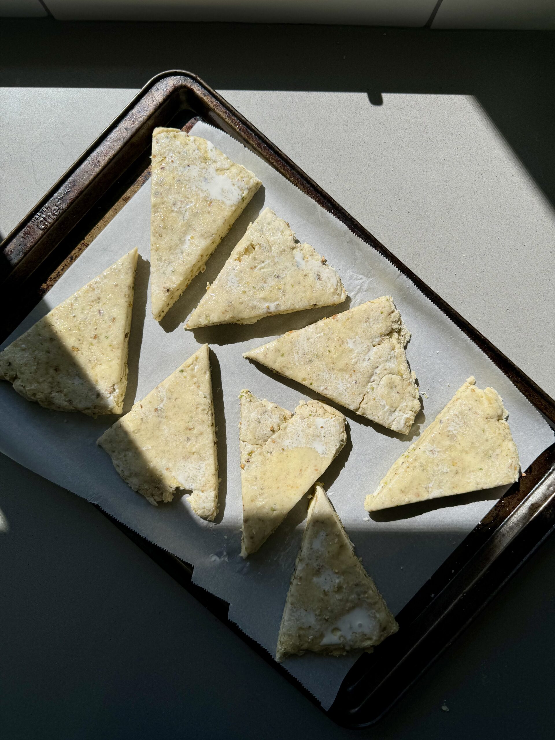 unbaked scones on a baking sheet.