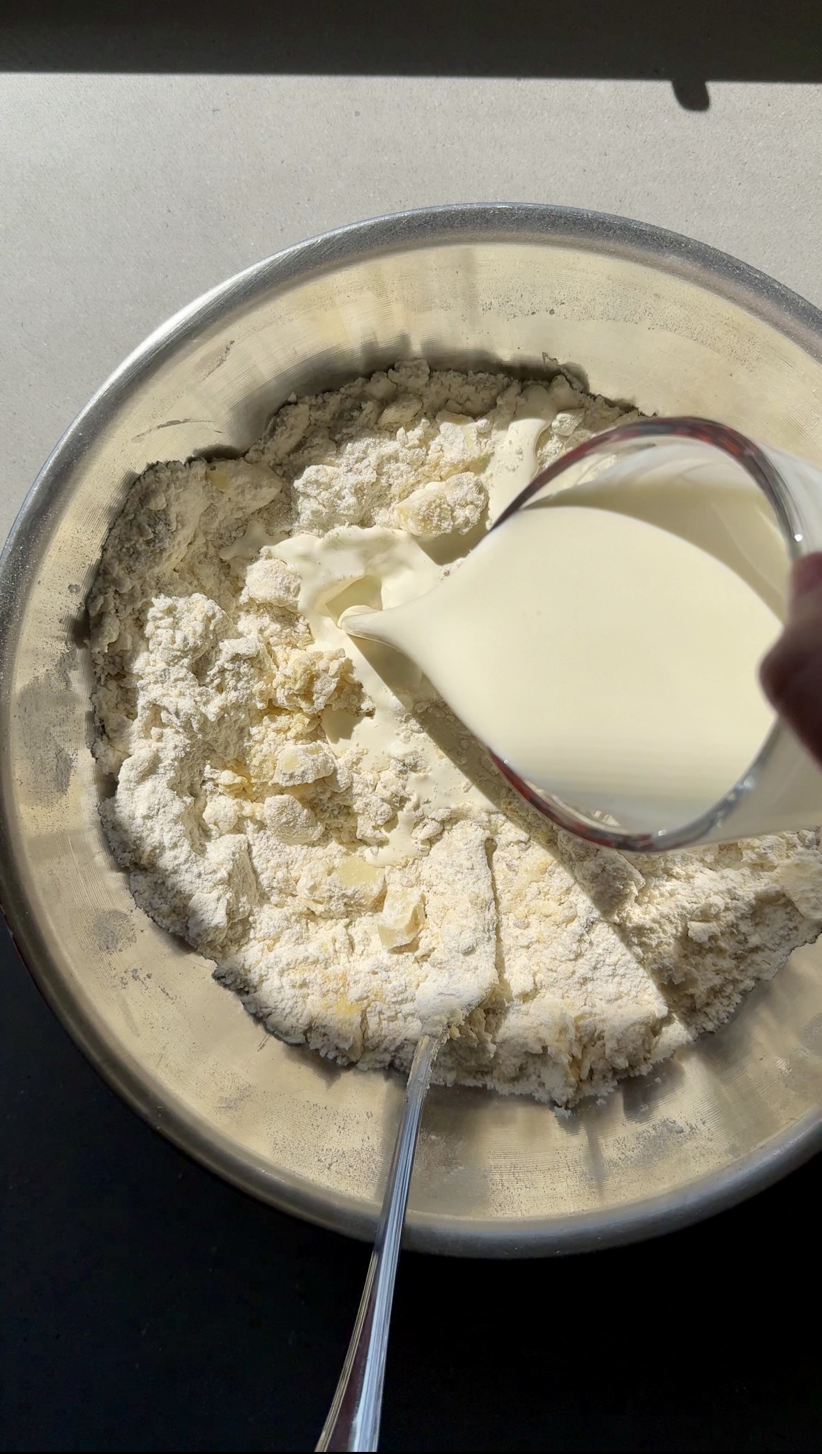 dry ingredients with milk being added.
