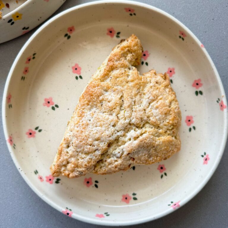 pistachio white chocolate scone on a plate.