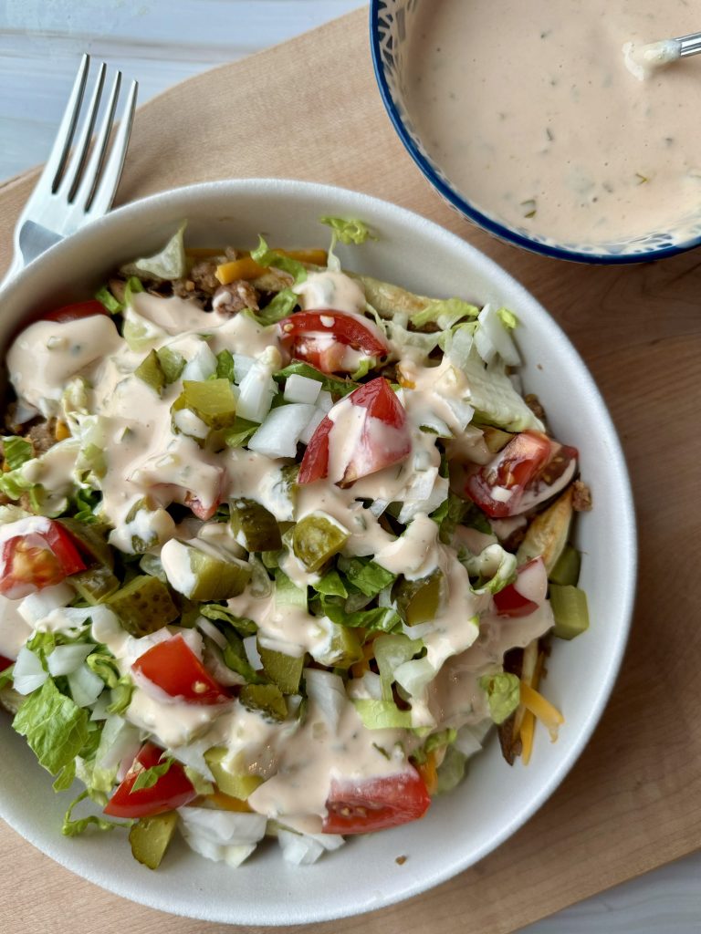 vegetarian big mac loaded fries in a white bowl