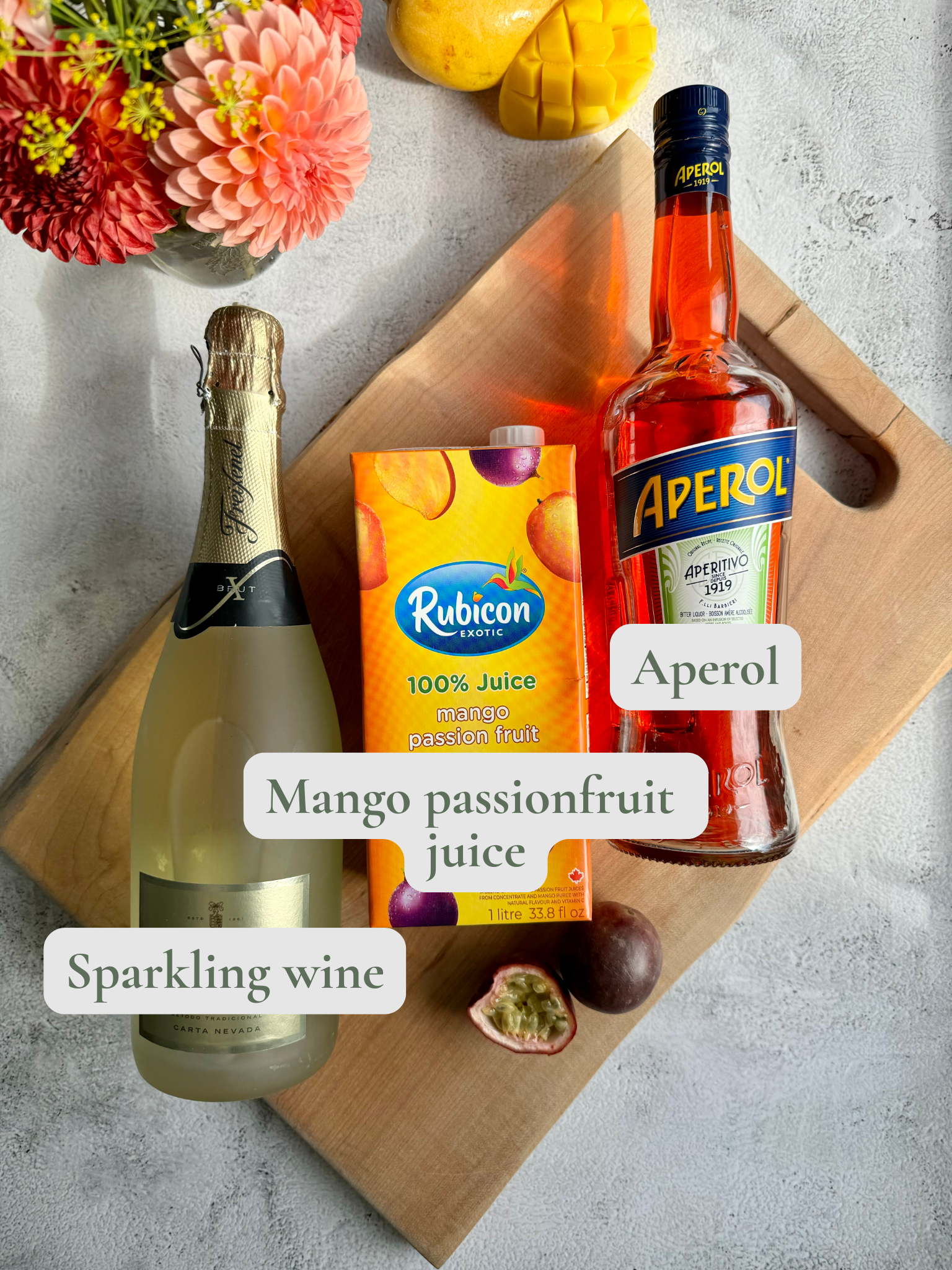 mango passionfruit spritz in a wine glass