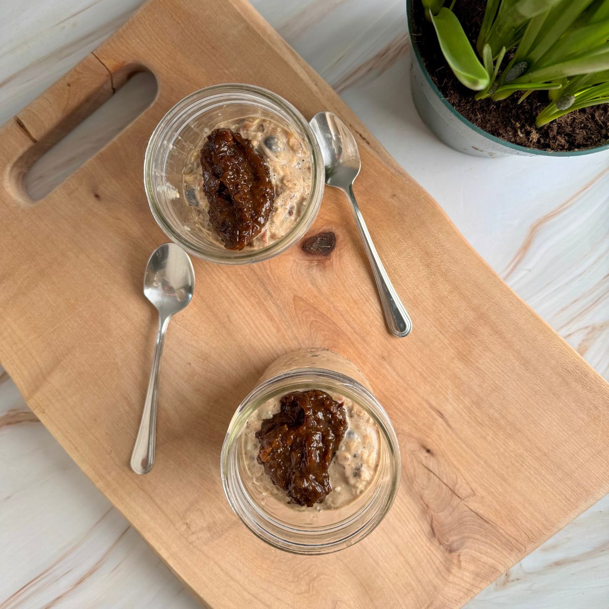 healthy muesli with prune puree in mason jars.